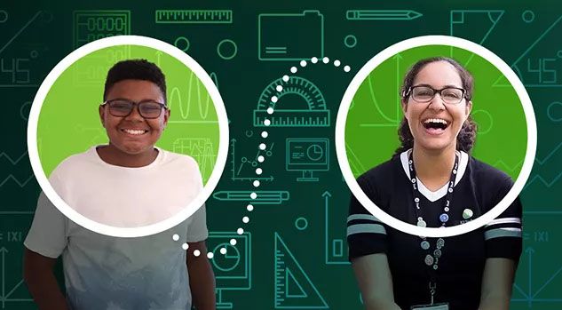 boy in white shirt with tutor and math chalkboard behind hi