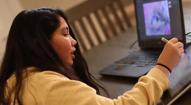 girl drawing on tablet