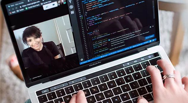 computer science instructor on laptop