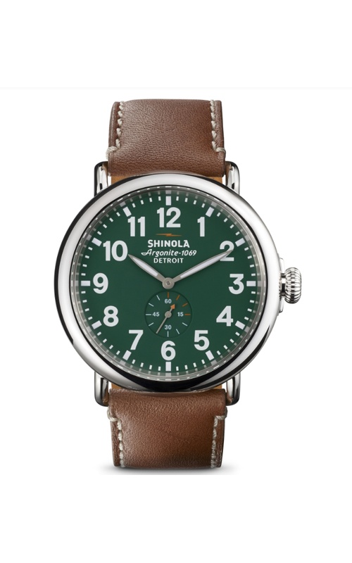Shinola Watch, Featuring A Green Dial, White Numbers, Super-LumiNova Hands With Orange Accents, Date Function, Within A 47MM Stainless Steel Case, A Double Curved Sapphire Crystal, Argonite Swiss Movement, The Signature Iconic Case Is Laser Etched With T