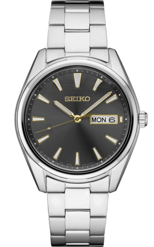 Seiko Watch, From the Essentials Collection-Dark gray dial with sunray finish and gold accents-Day/Date calendar-LumiBrite hands and markers-Sapphire crystal-Case diameter: 40.2mm-Stainless steel case and bracelet,Water-resistant to 10 bar, 100 meters (30