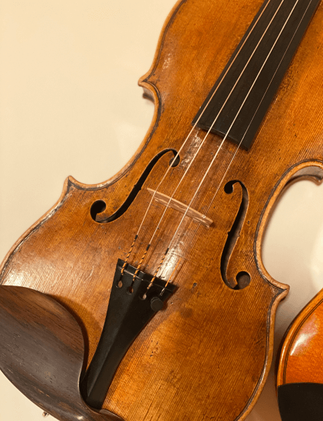 Andrea Amati violin model hrandcrafted by Pierre Flavetta in a table