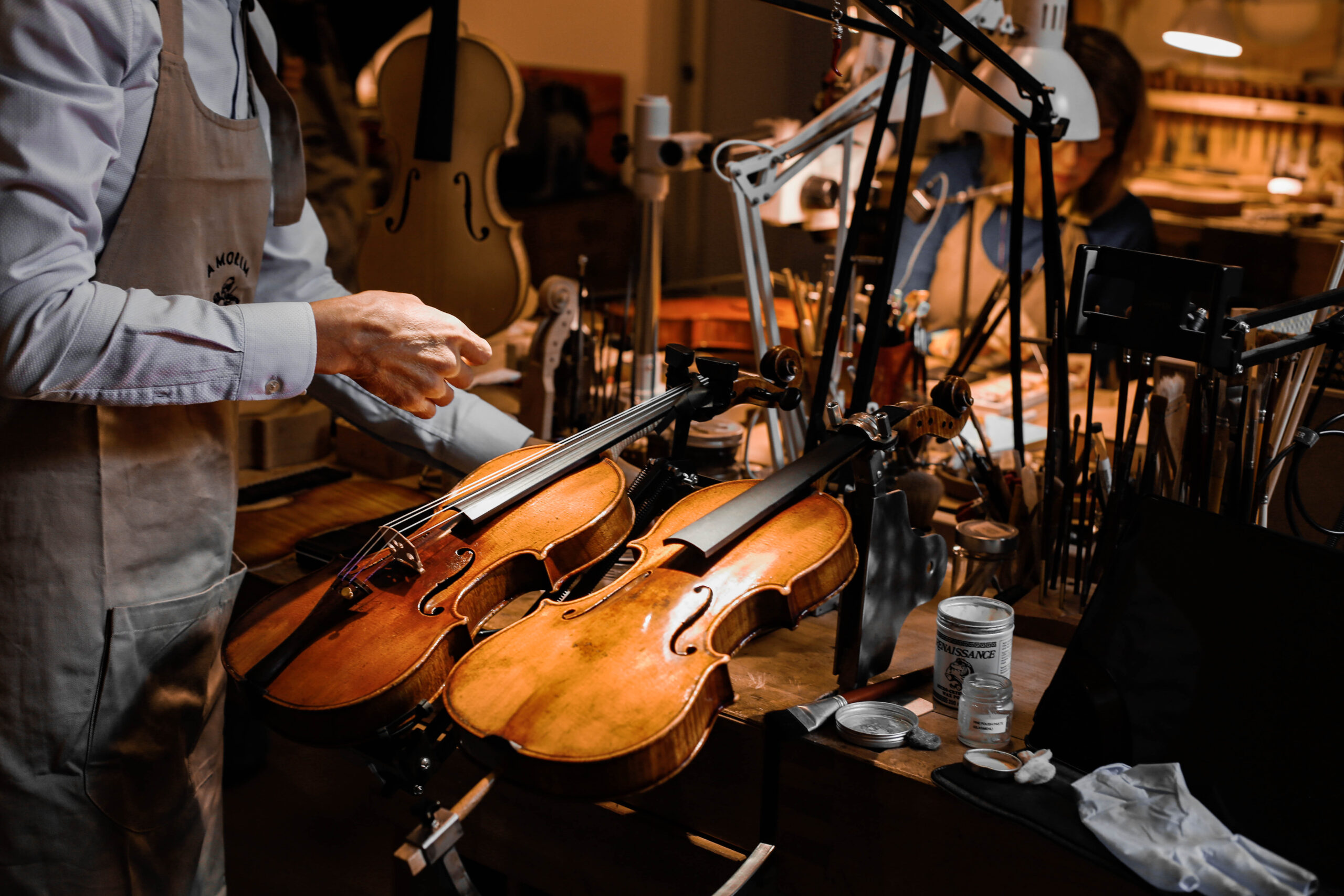 Violins undergoing professional maintenance and repair by luthiers at Amorim Fine Violins
