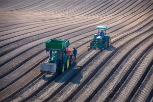 Two tractors planting Gladiola bulbs at Glad-A-Way Gardens in Santa Maria