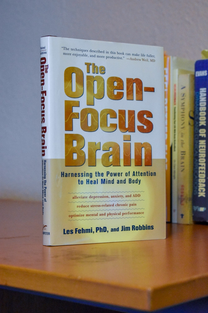 How can real-time fMRI be used in neurofeedback applications for mental health disorders?