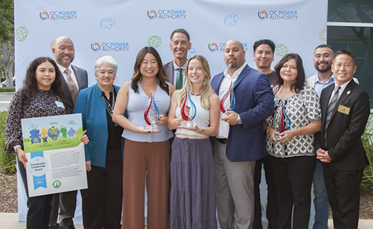 2025 OCPA Community Impact Awards recipients pose at the ceremony.