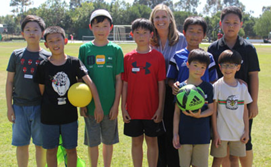 Sandra Simpkins (back, center) with a group of children from an after-school program.