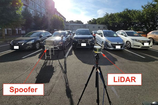 Computer science and electrical engineering researchers at UCI and Japan’s Keio University demonstrated that they could fool the sensing systems that enable autonomous vehicles to navigate streets and roads into perceiving objects in the roadway or missing them entirely. Their custom-designed experimental apparatus, pictured here on Keio University's Yagami campus, included a laser, lens and advanced electronics. Yuki Hayakawa / Keio University