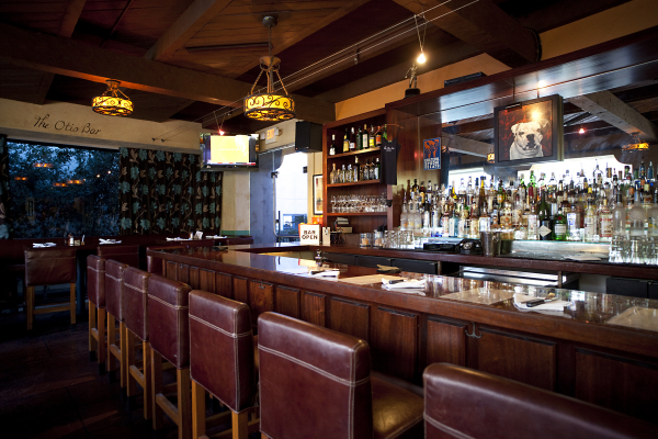 The bar and stools at The Otis Bar