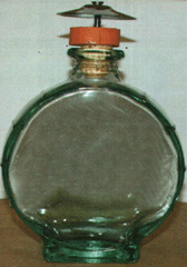 Imagen de la patente MODELO INDUSTRIAL DE ENVASE CON TAPON PARA BEBIDA ALCOHOLICA.