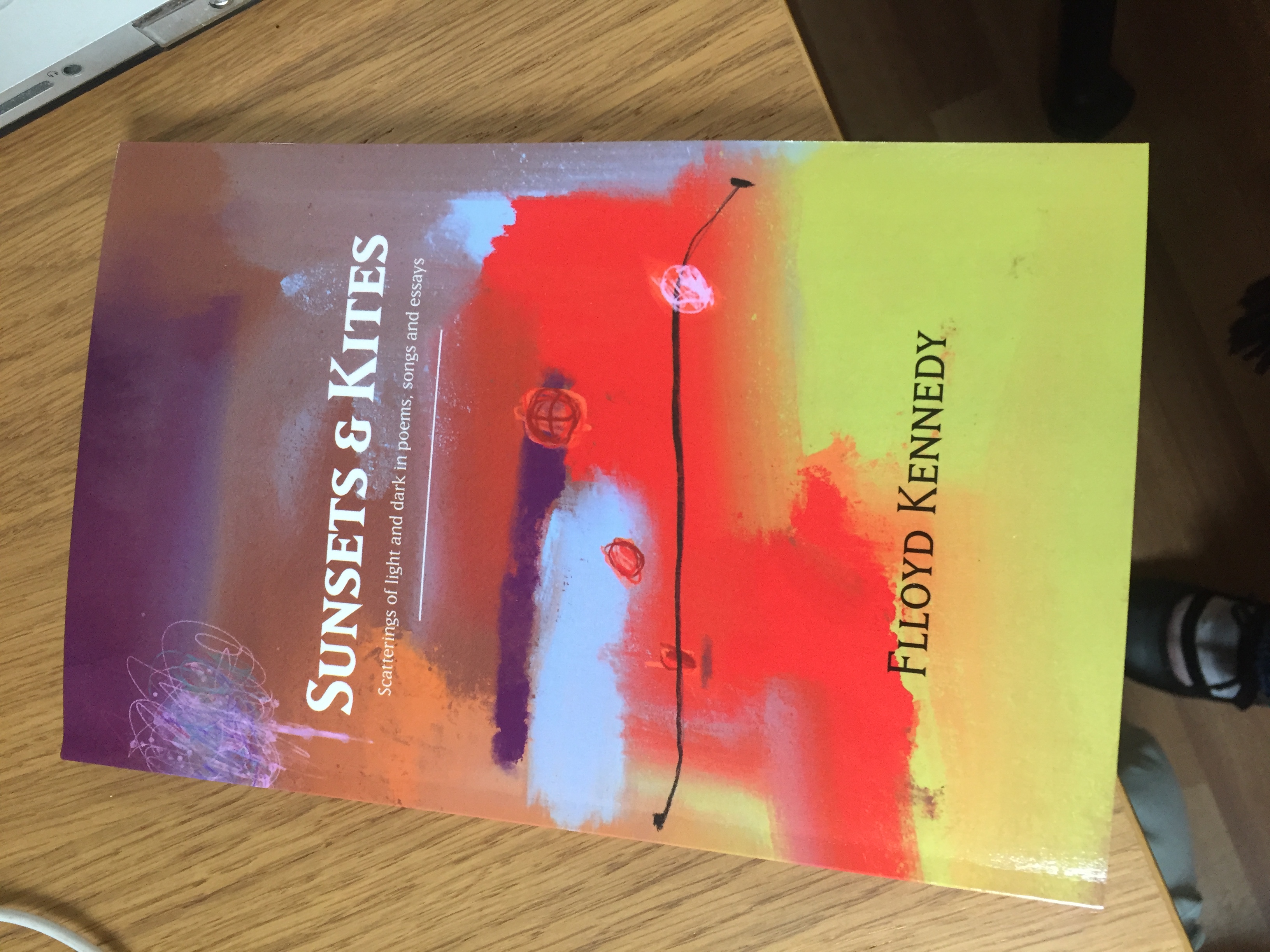 Sunsets & Kites: scatterings of light and dark in poems, songs and essays.