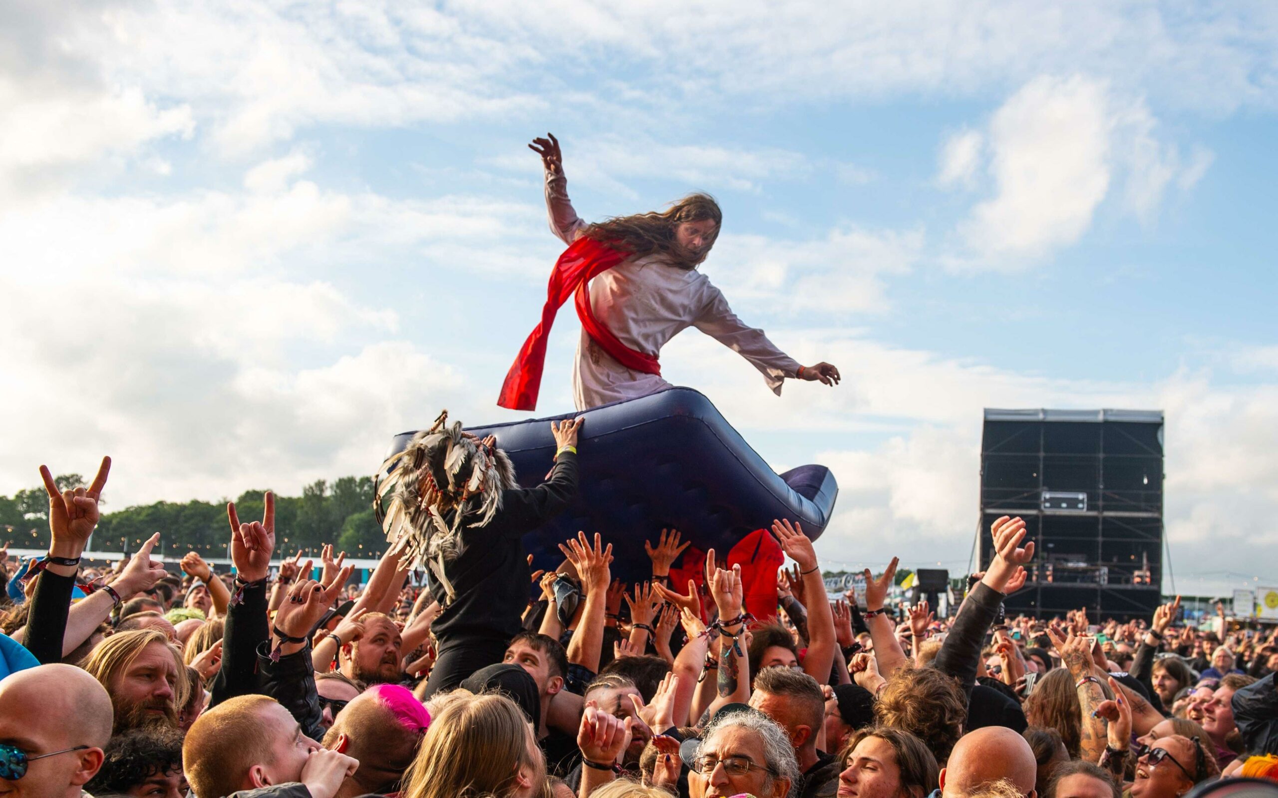 A fan dressed as Jesus crowd surfs during the Download PILOT festival at Donington Park, England, June 20, 2021. 