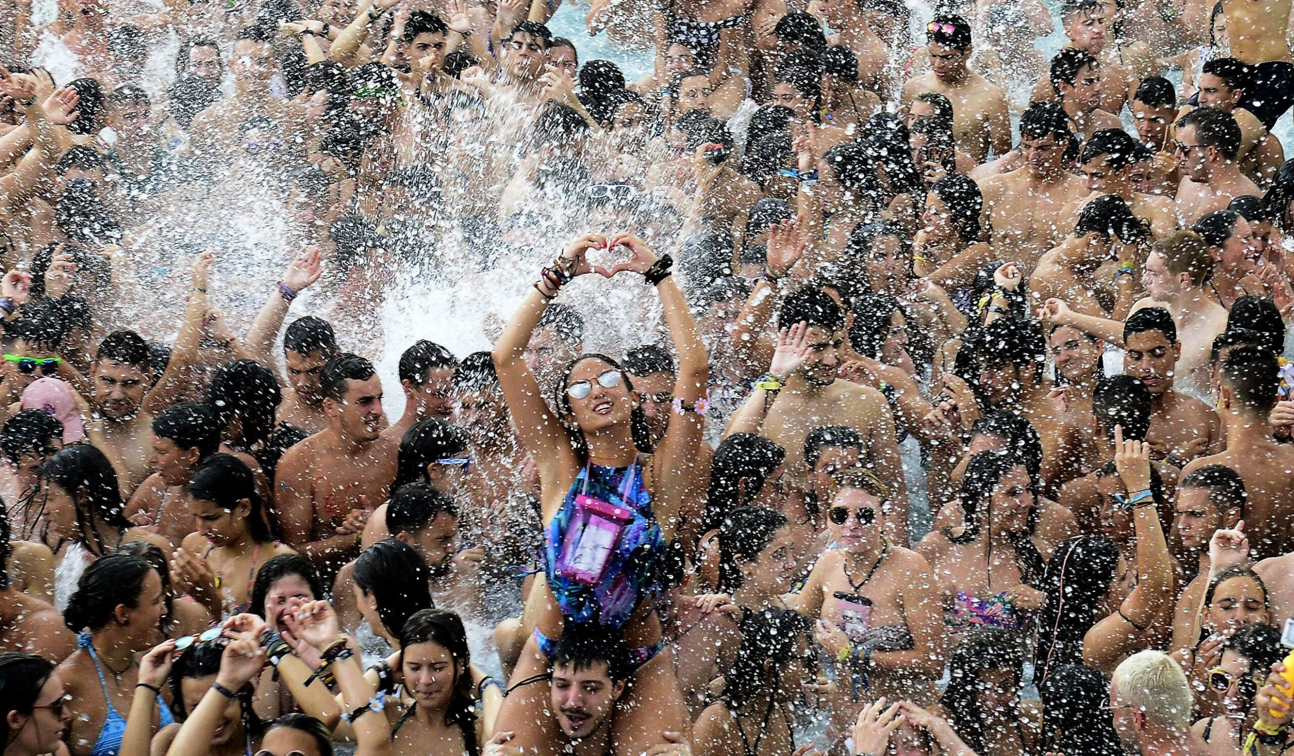 People dance in a pool during the Arenal Sound Festival on the east coast of Spain between Valencia and Castellon. 