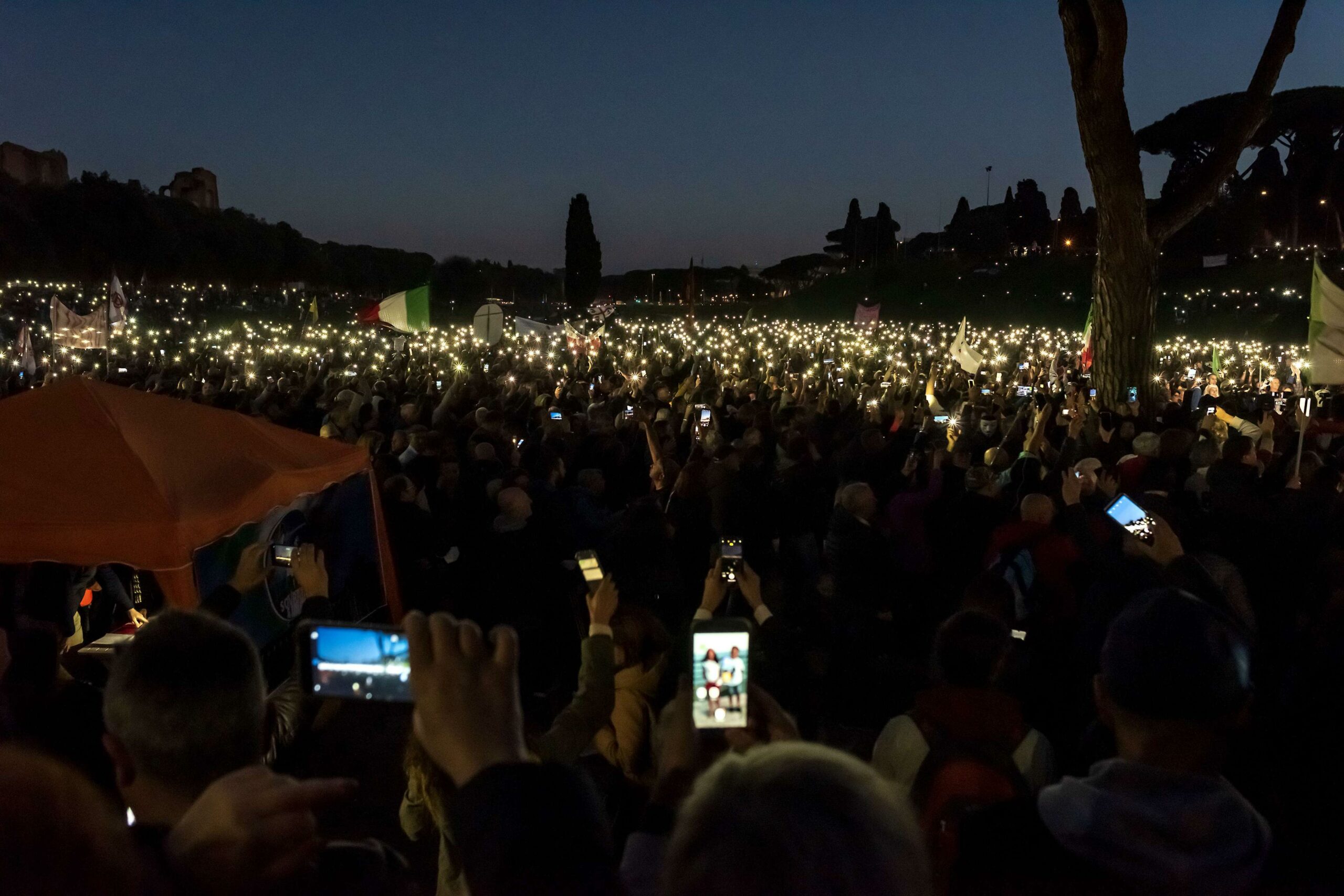 People protest during a demonstration against the Green Pass health certificate, at Circo Massimo in Rome, Italy, Nov. 20, 2021. 