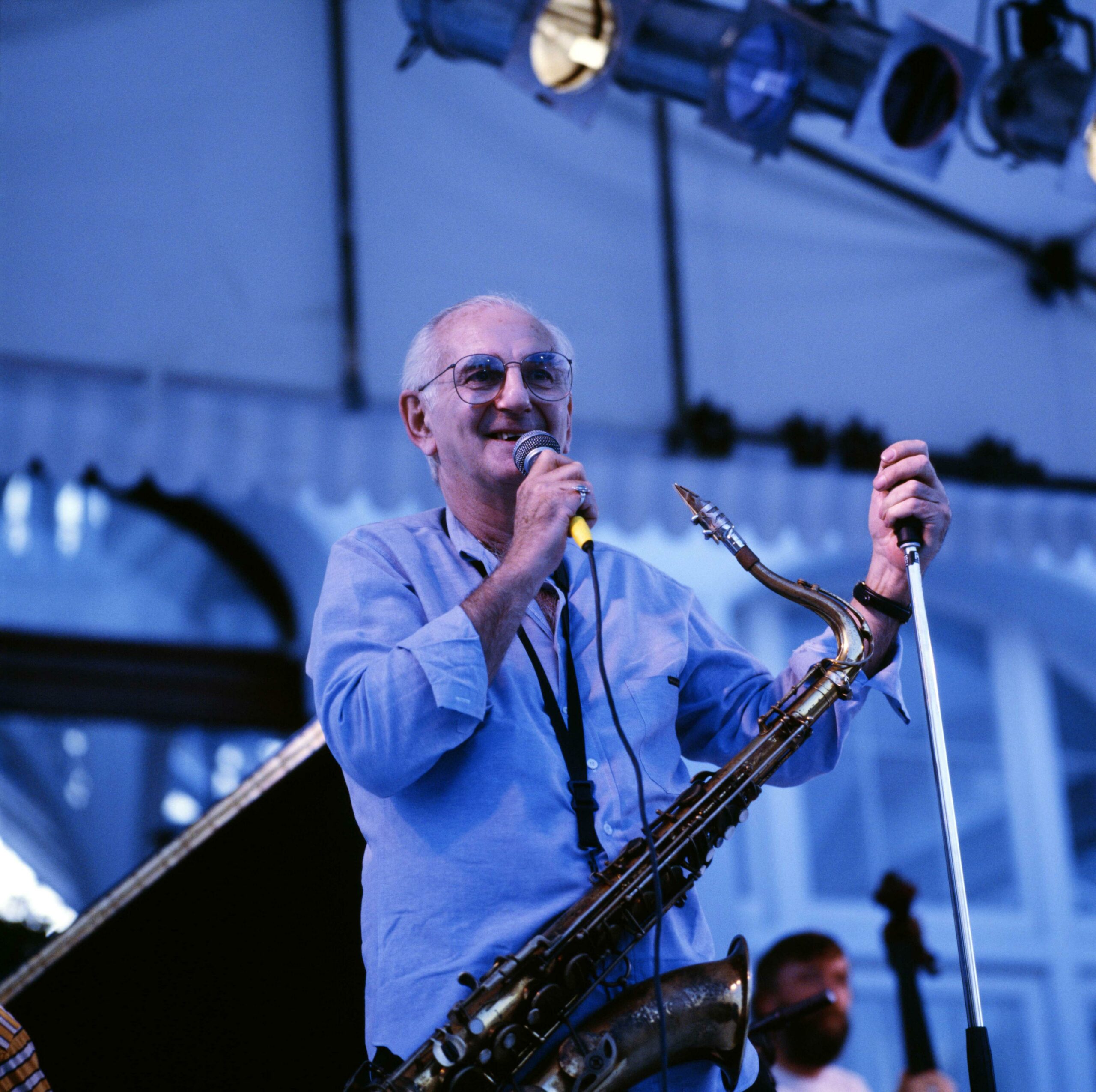 Ronnie Scott performing on stage.