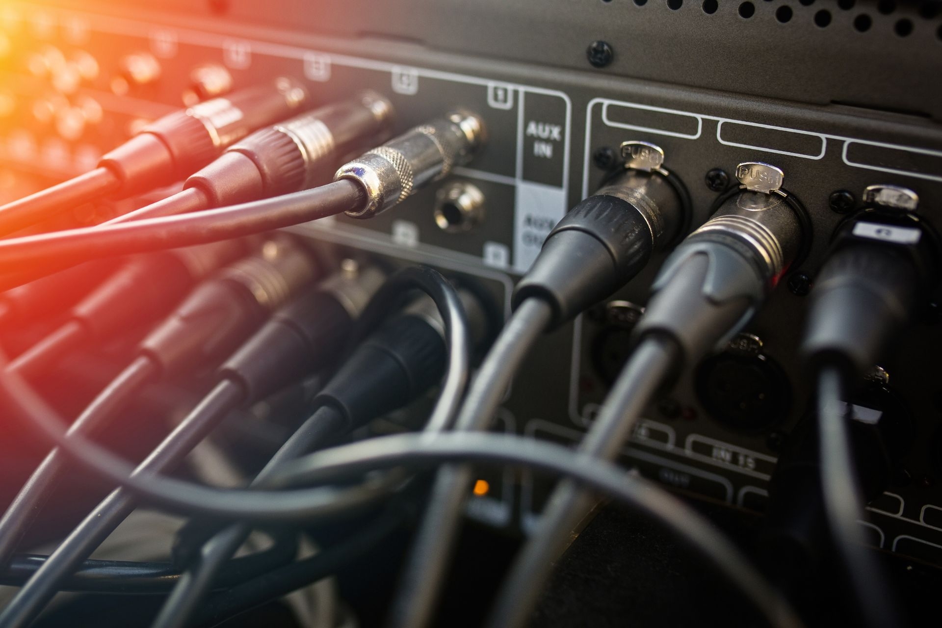 What are some common scenarios where using balanced audio connections is recommended over unbalanced connections?