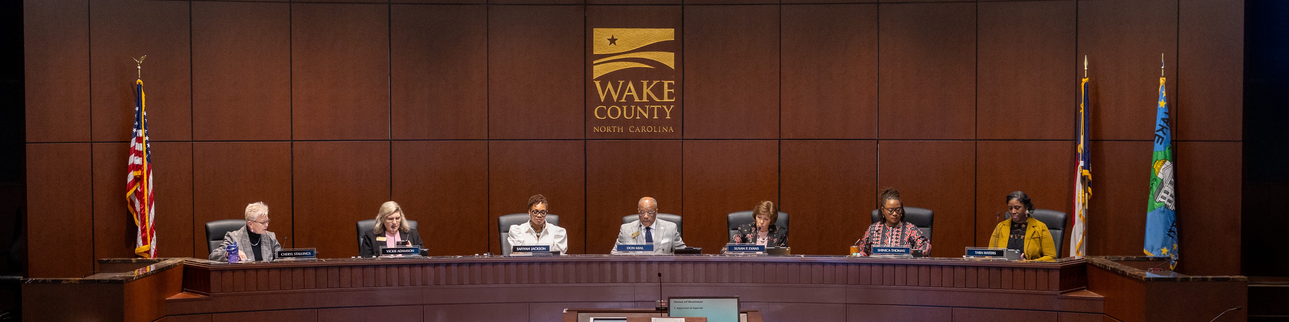 The Wake County Board of Commissioners conducts a meeting in the Board room.