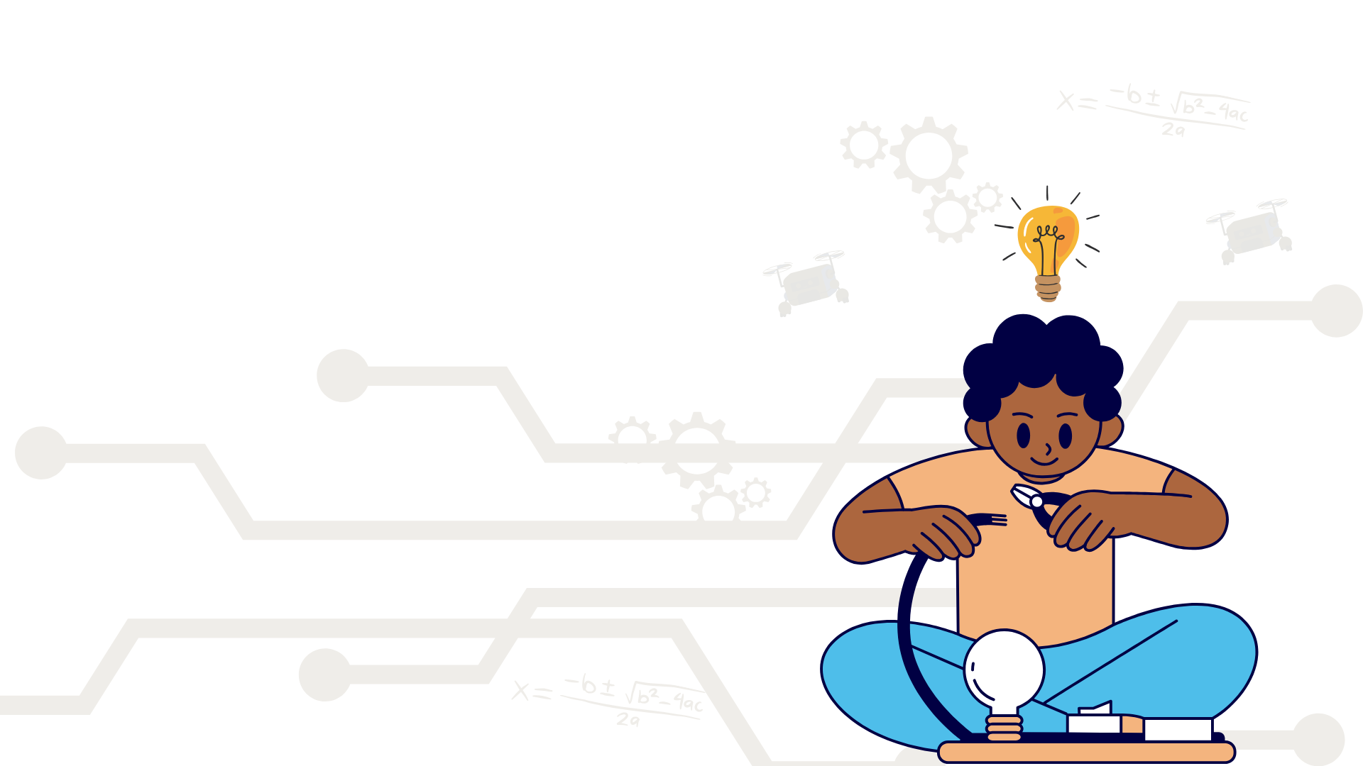 a young boy sitting and connecting a wire to a lightbulb