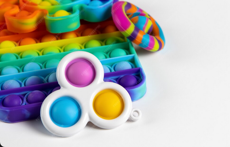 A pile of colorful sensory fidget toys.