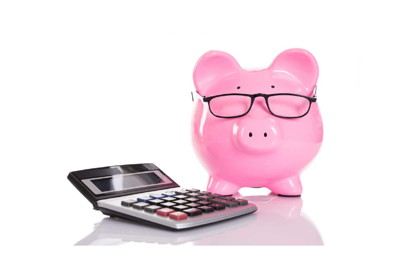 Piggy bank next to calculator