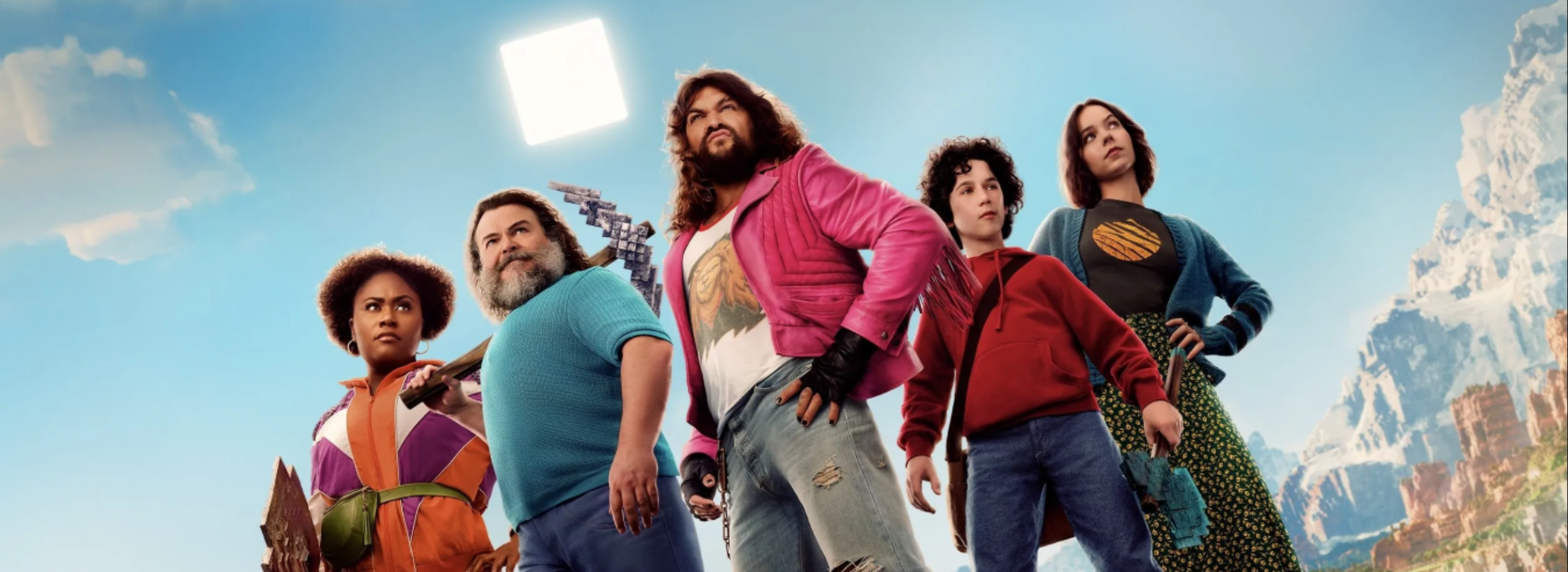 Cast of Minecraft movie standing in a line
