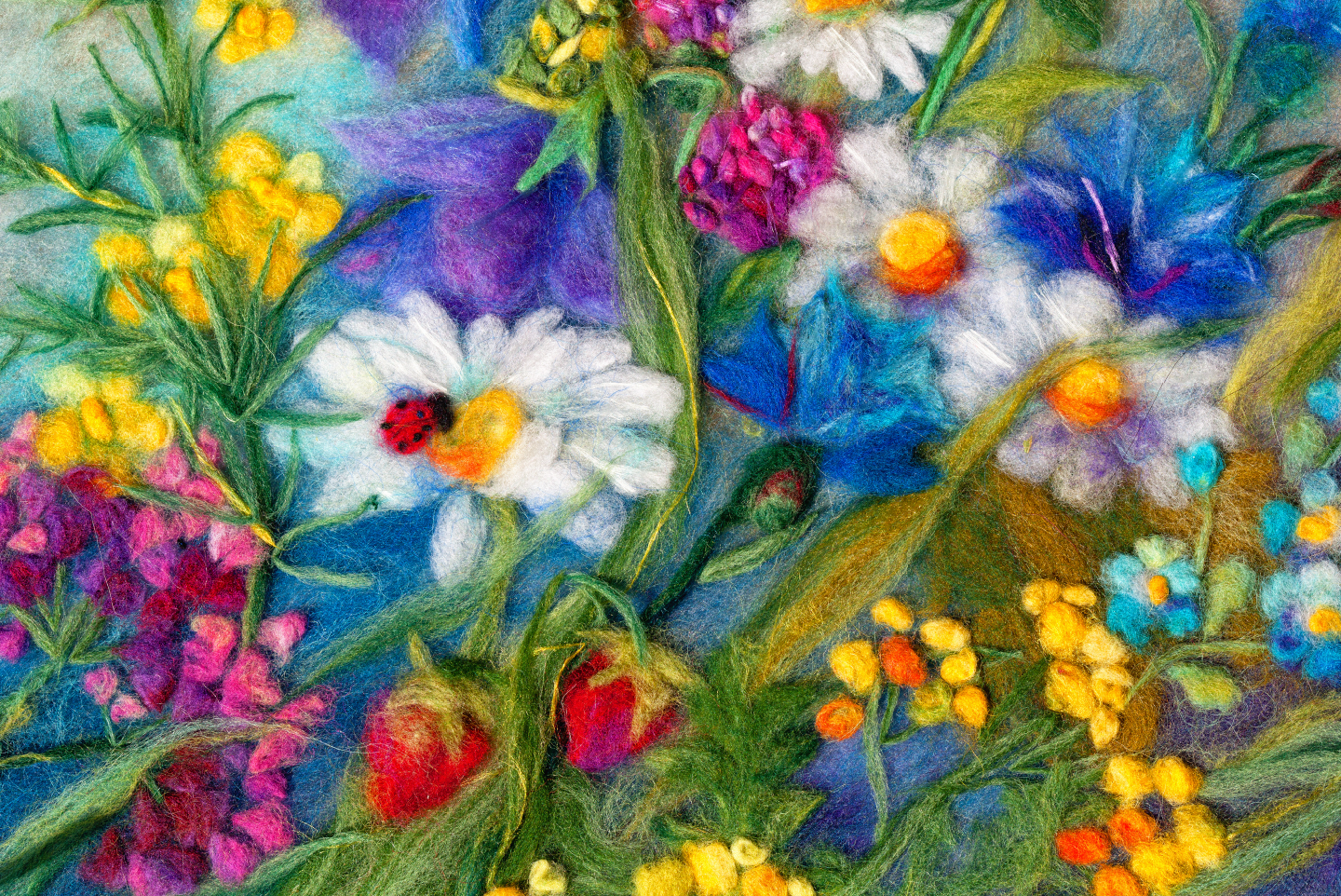 felted scene with vibrant flowers, plants, and ladybugs