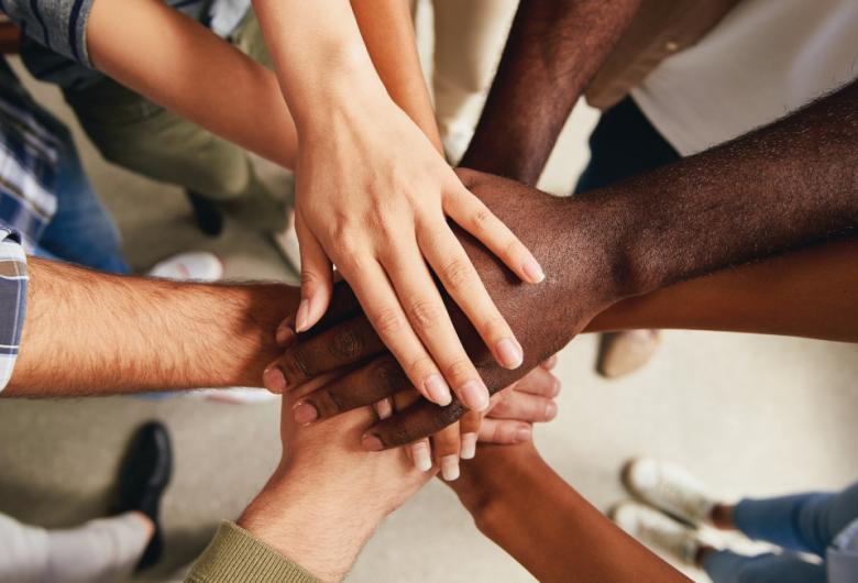 Group of people holding hands