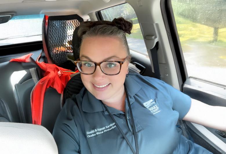 smiling woman sitting in car