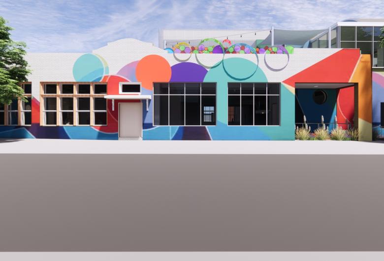 Street-level rendering of a modern building façade painted with a vibrant, abstract mural