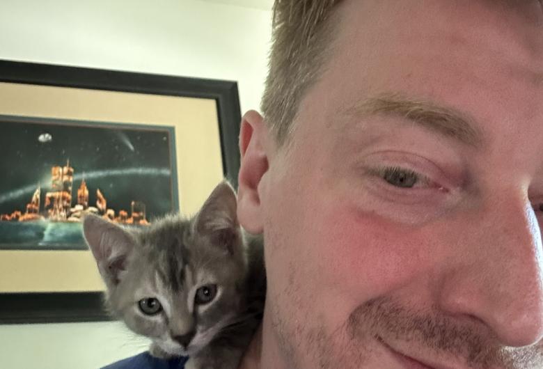 Kitten sitting on Trevor's shoulder