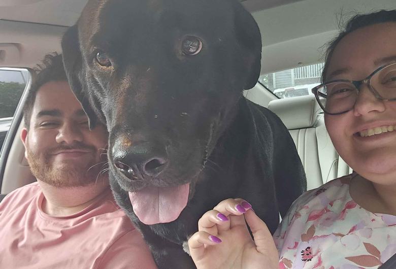 Jimmy sits between Gabriella Agnello and her partner in a car.