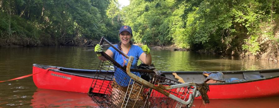 volunteer holding a shopping cart