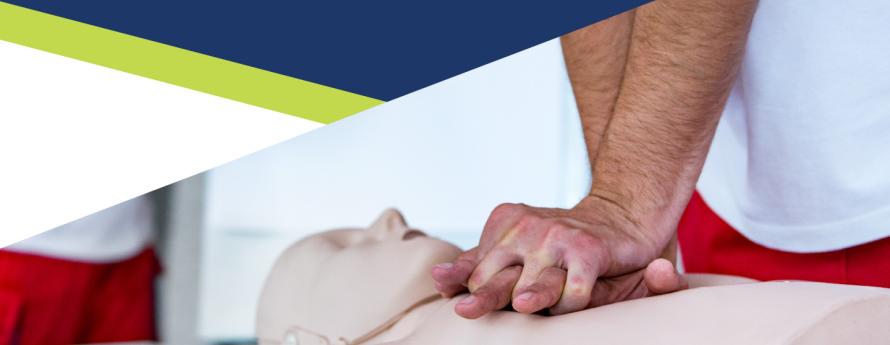 Man practices CPR compressions on a mannequin