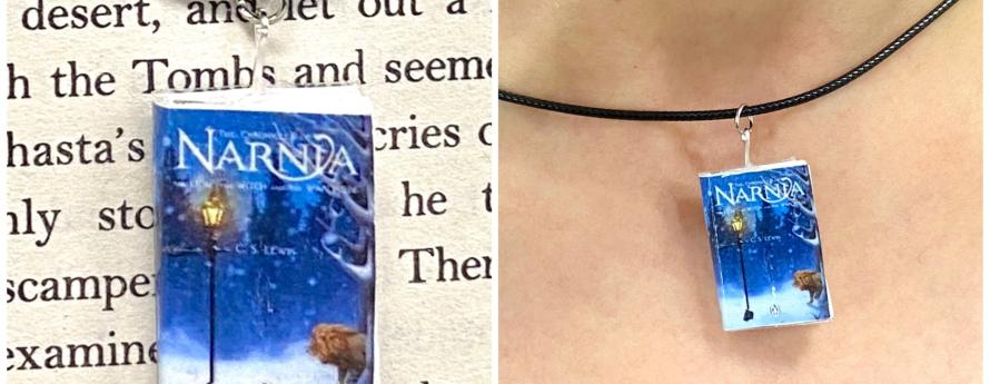 A miniature copy of The Chronicles of Narnia on a leather cord necklace