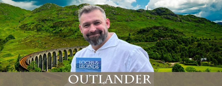 Andy the Highlander holding his book "Lochs and Legends"