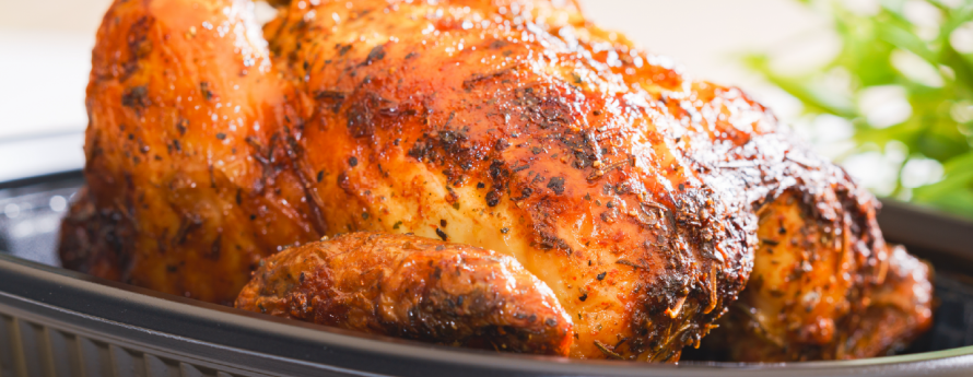 a storebought rotisserie chicken in a plastic container