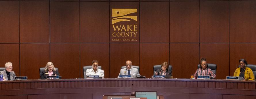 The Wake County Board of Commissioners conducts a meeting in the Board room.