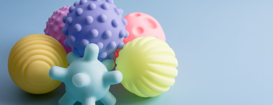 Multi-Colored Baby Sensory Toys on a blue background