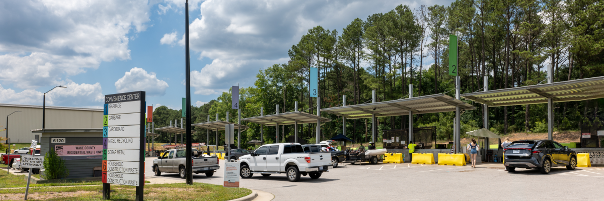 vehicles and customers carry waste into convenience center bays