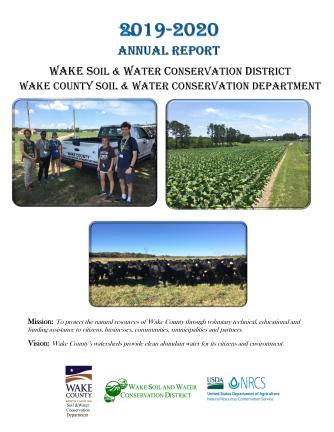 Students next to Wake SWCD truck, crop rows, herd of black cows.