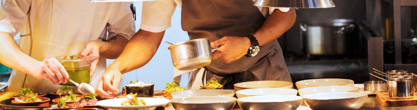 Chefs preparing food at a restaurant