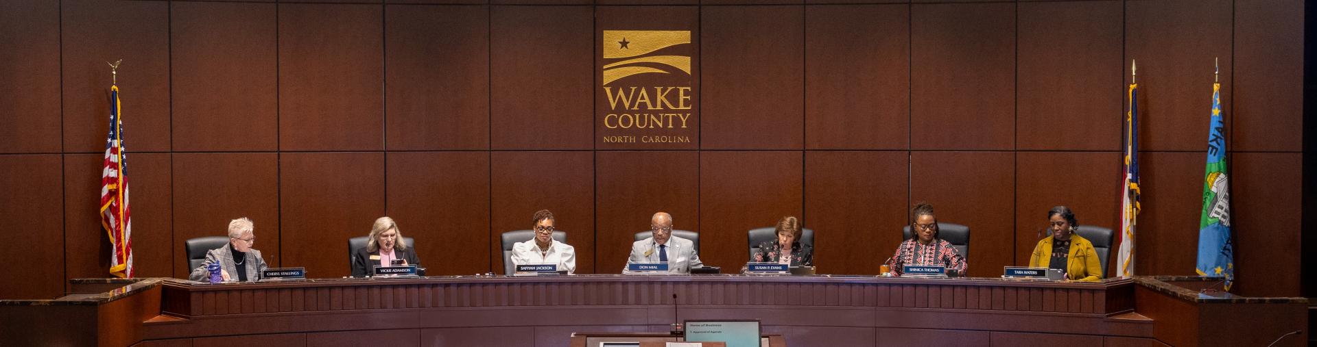 The Wake County Board of Commissioners conducts a meeting in the Board room.