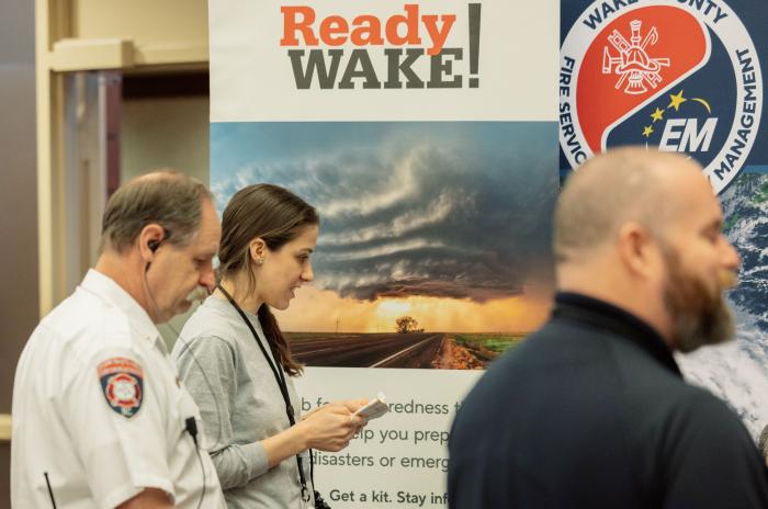 BEST conference attendees in front of a ReadyWake! banner
