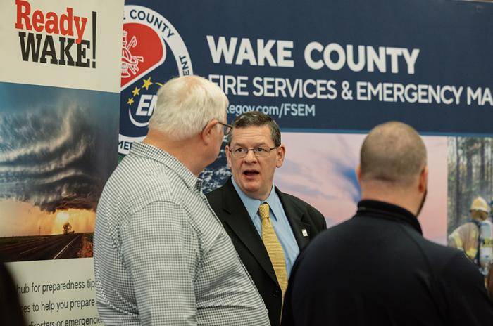Wake EM Director Josh Creighton speaks with conference attendees