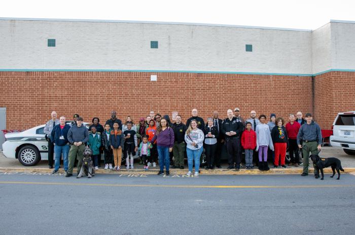 A group of people smiling out of Target. 