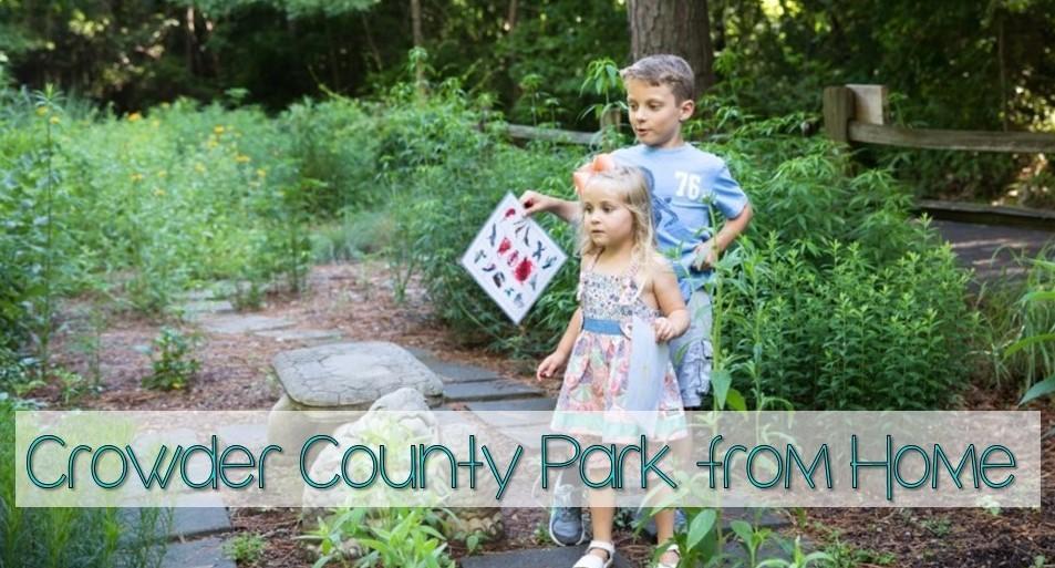 Two children wander through the flower garden with their nature scavenger hunts