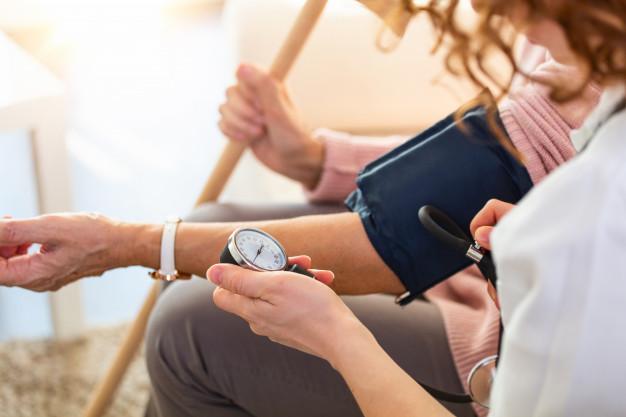 Nurse attending to a patient at home