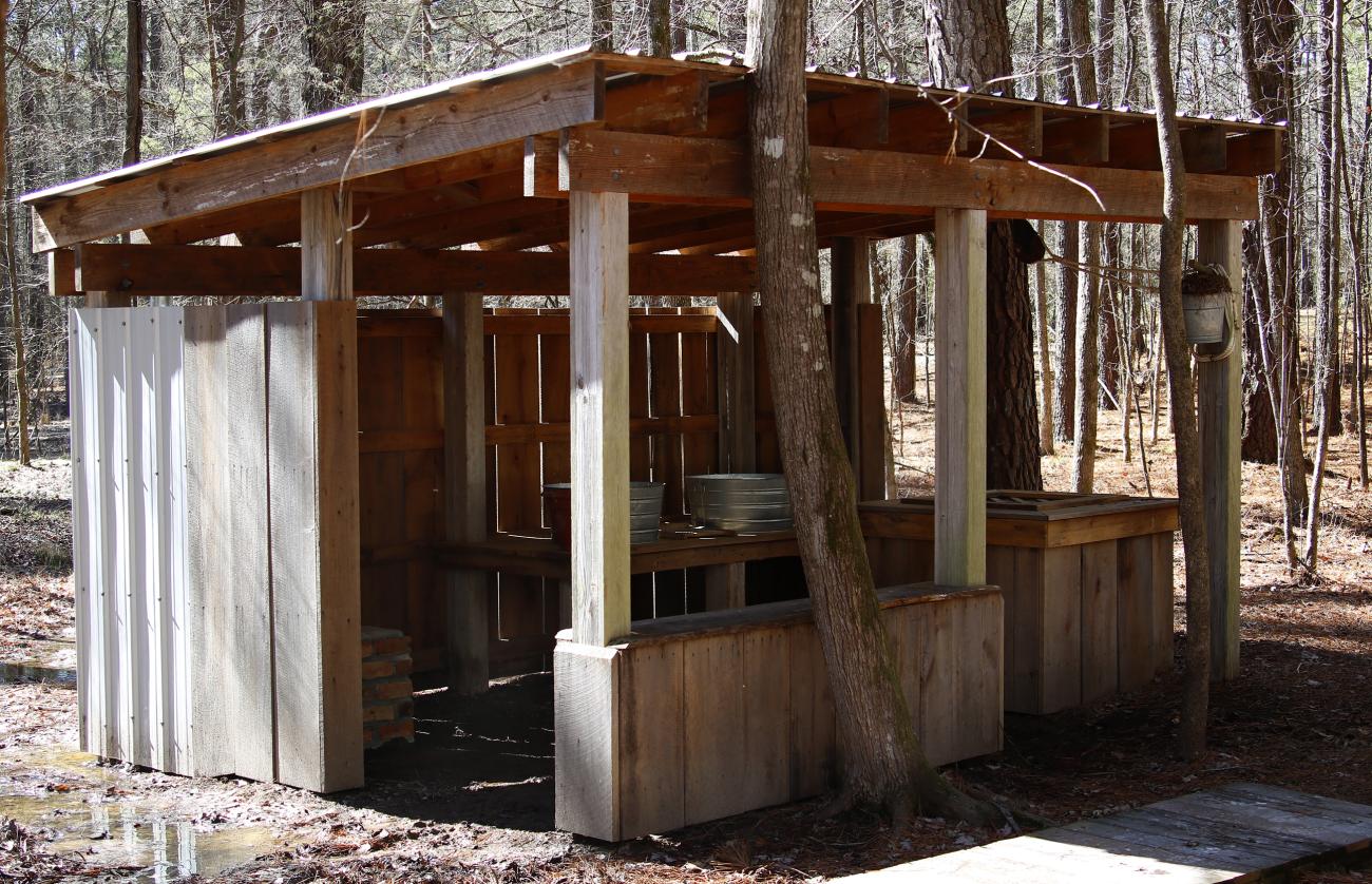 A photo of the restored Wash House which is visible along the park's History Trail