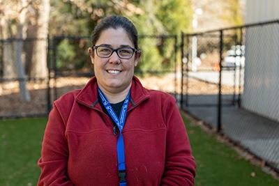 Dr. Jennifer Federico smiles in the courtyard at the Wake County Animal Center