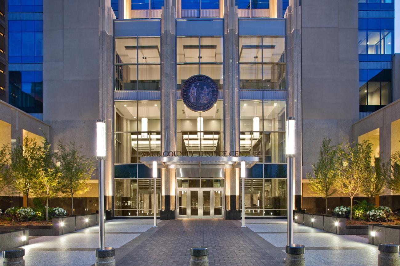 Front entrance of Wake County Justice Center at twilight